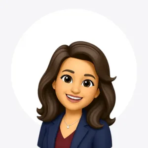 Avatar illustration of a smiling woman with dark brown hair, wearing a navy blazer and red top.