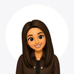 Smiling cartoon avatar of a young woman with shoulder-length dark brown hair, wearing a brown jacket over a black shirt, on a white circular background