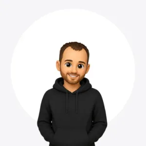 Cartoon avatar of a smiling man with brown hair and beard, wearing a black hoodie with hands in pockets.